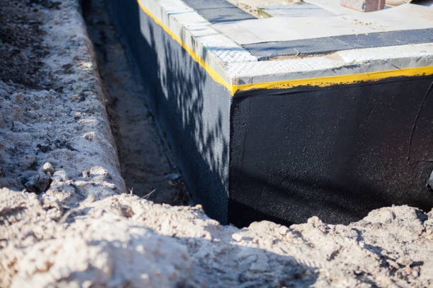Professional Waterproofing technician working in Oolitic, IN